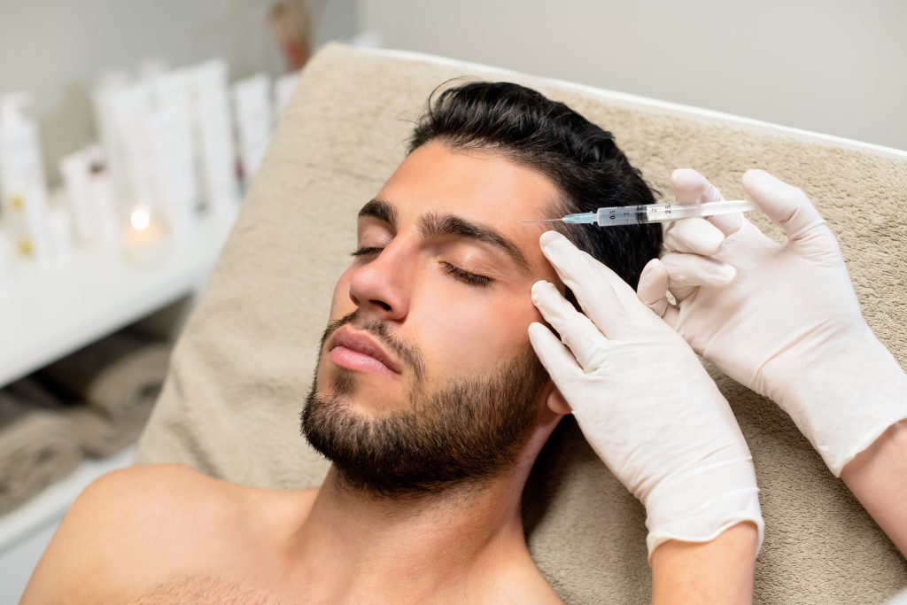 a man getting a botox injection